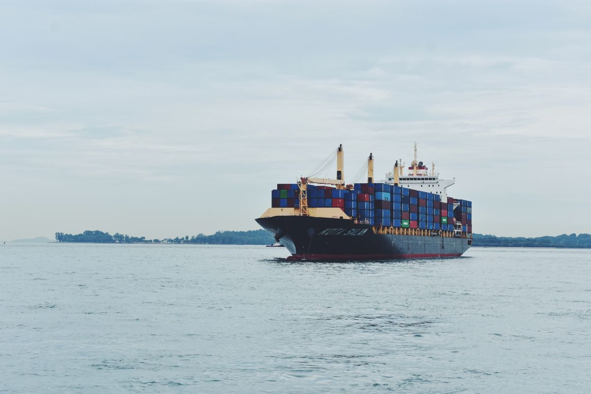 Container ship carrying cargo across the sea